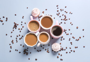 Obraz na płótnie Canvas Cups of tasty coffee on color background