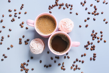 Cups of tasty coffee on color background
