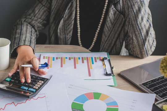 Woman using calculator