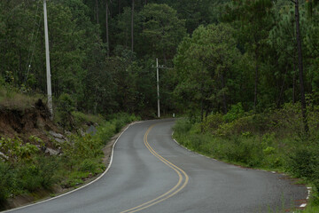Highway from the mountains of Sinaloa towards the western Sierra Madre, young people on motorcycles.