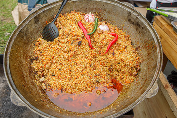Freshly cooked pilaf in a large bowl. An oriental dish.