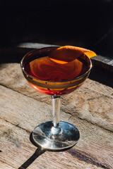 bourbon whiskey whisky Manhattan gold 60s coupe glass cocktail happy hour on barrel orange twist 