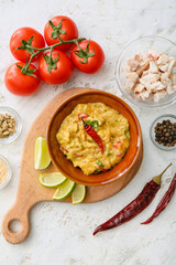 Composition with tasty chicken curry on light background