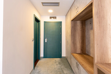 Entrance corridor interior with a mirror in closet wardrobe