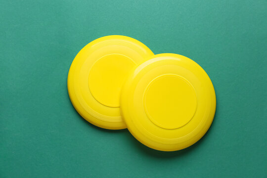 Frisbee disks on color background