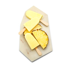 Board with tasty pineapple popsicle on white background