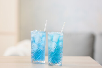 Glasses of Blue Lagoon cocktail on table
