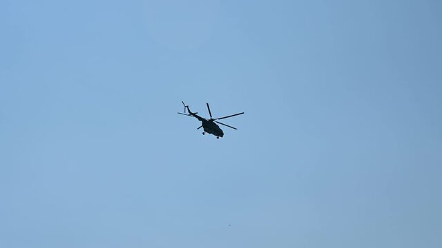 MI 8 helicopter flying in the sky. Military helicopter flies in the air during rescue action.