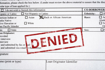 Image of a generic mortgage application with black and African American box marked and a red denied...