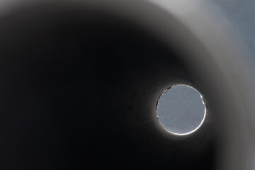 Light hole at the end of the black pipe. Abstraction. The concept of clinical death and exodus of...