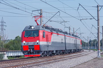 Fototapeta na wymiar Freight modern electric locomotive approches.