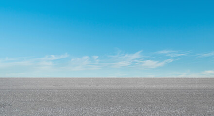 Empty asphalt road over blue sky cloud background