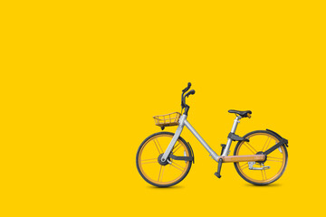 Fototapeta na wymiar Bicycle on vivid yellow color background