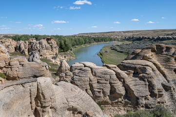 Fototapeta na wymiar Rock formations on the edge of the Milk River in Writing on Stone Provincial Park in Alberta, Canada