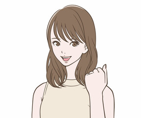 笑顔でガッツポーズをする女性