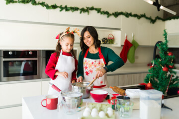 Mom and daughter baking dessert