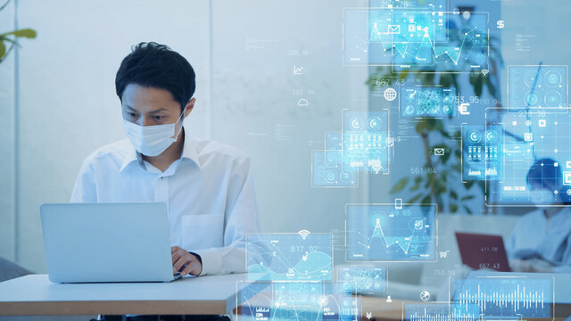 マスクをして仕事をするビジネスマンと技術イメージ