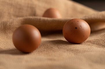 warm ambient, eggs on wooden table 