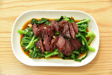 Honey char siu or honey-glazed barbecue pork and Choy Sum or Chinese flowering cabbage. Authentic Chinese Food, delicious cantonese gourmet.
