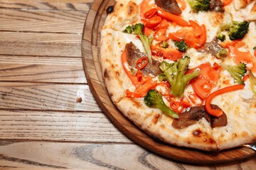 Pizza on wooden table top view. Fast food. Post blog social media. with copy space. Pizza ready to eat
