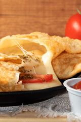 Delicious pastel of cheese, tomato and  oregano close up.