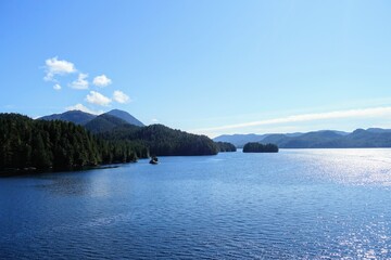Majestic views of the forested mountains and beautiful blue ocean along the british columbia coast...