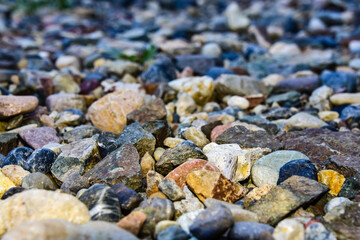 Rocks sea beach or stones background, Many small stones in assorted colors, Abstract rough wallpaper nature concept