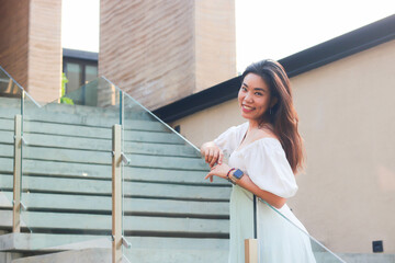 Portrait of beautiful asian woman on stairs