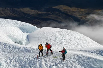 Fotobehang Mountaineers taking picture in the glaciers of Cotopaxi, Ecuador.  © Milo Andrade Dávila