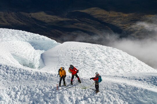 Mountaineers taking picture in the glaciers of Cotopaxi, Ecuador. 