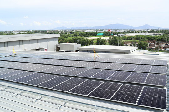 Solar PV on Warehouse Roof Mountain Background