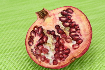  Sweet ripe pomegranate seeds in a porcelain plate