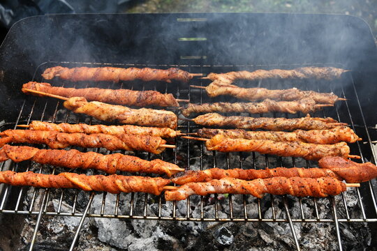 Roasting Frigarui ,skewers,on an outdoors grill