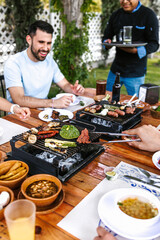 Group of latin friends eating mexican food in the restaurant terrace in Mexico Latin America