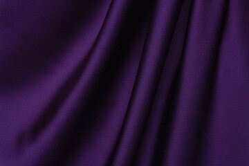 Draped dark violet silk background