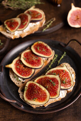 Sweet bruschetta with cream cheese and figs for breakfast