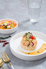 Top view eating healthy meal, rice with salmon roe, mixed salads,  and soup vegetarian food on grey background. Dietary food. 