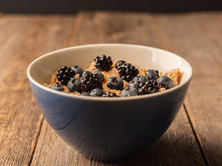 Fototapeta na wymiar Oatmeal porridge with berries. Selective focus.