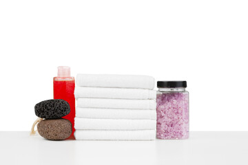 Spa still life with stacked of stone and towel isolated on white
