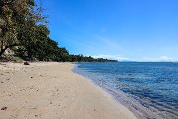 beachside photo with water and blue sky