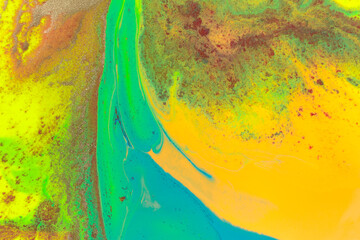 Yellow and green smudges of paint. Abstract pattern.