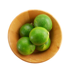 green lemon in wooden cup on white background