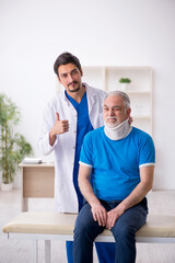 Fototapeta premium Old neck injured male patient visiting young male doctor