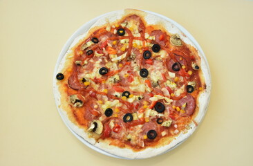 Pizza four friends, with olives and salami