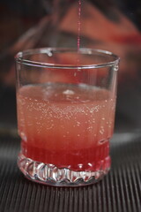  crystal Glass with efervescent tablet in water with raspberry 