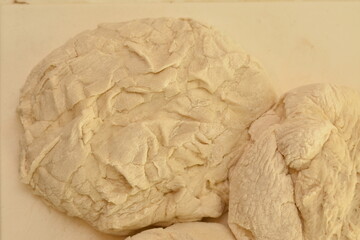 pizza dough on a plastic countertop