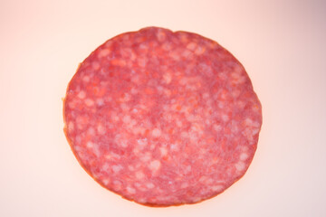 Sliced salami smoked meat isolated on white background.