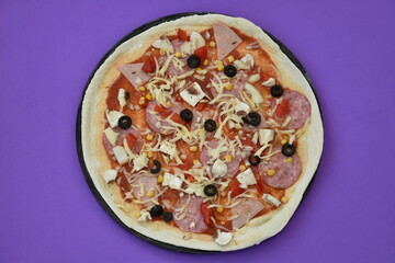 homemade pizza prepared for the oven,