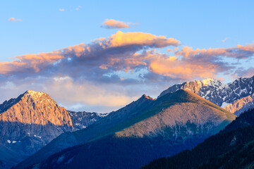 Beautiful mountain and colorful clouds natural landscape at sunset in Xinjiang,China.