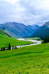 Fototapeta na wymiar Beautiful grassland and green mountain natural scenery in Xinjiang,China.